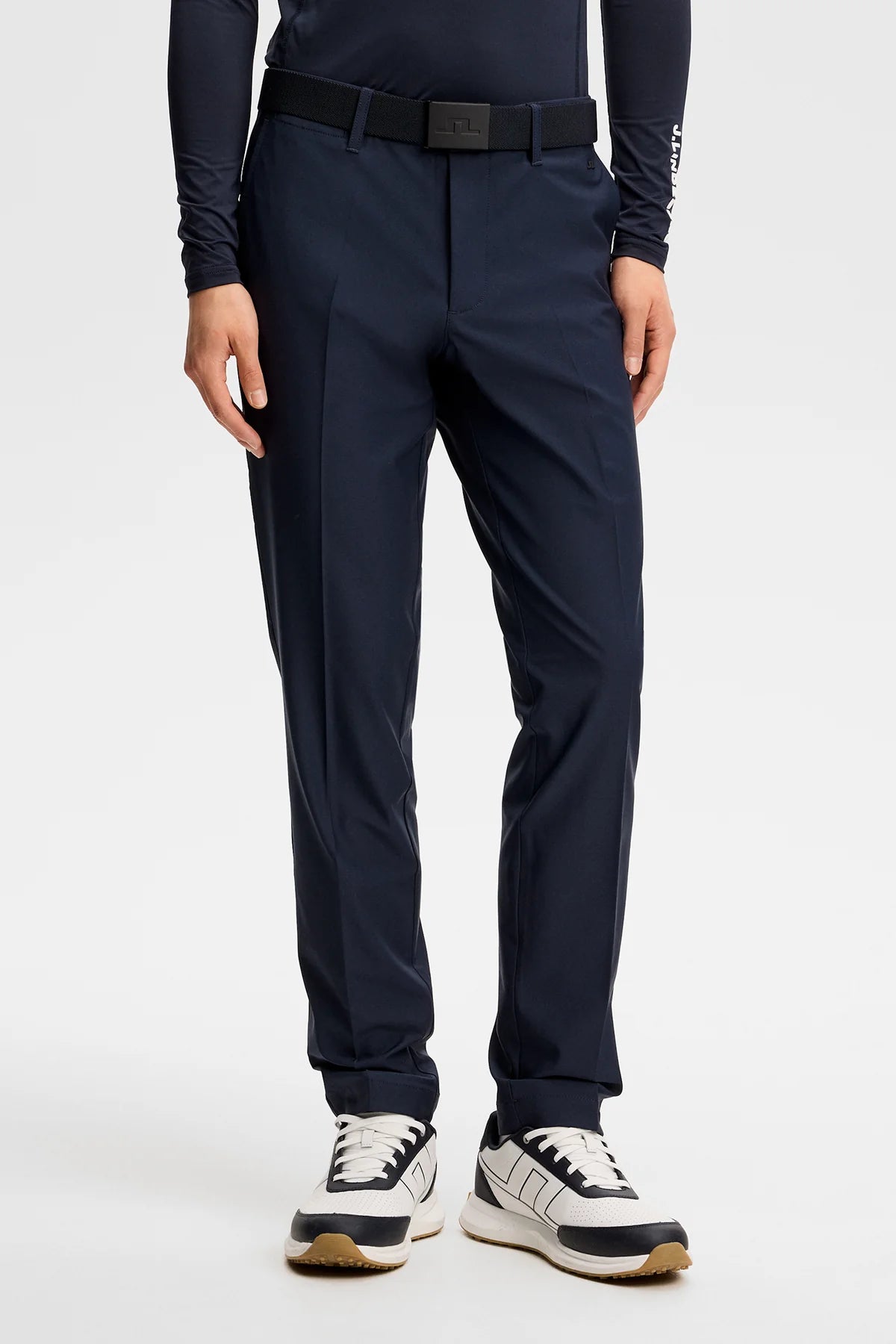 Navy dress pants with belt loops, pleated front, and tapered legs