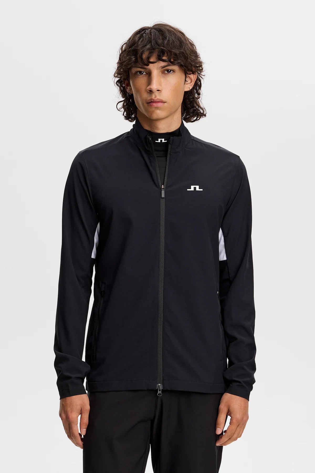 Men's black hybrid jacket with full-zip front, stand collar, and JL logo at chest.