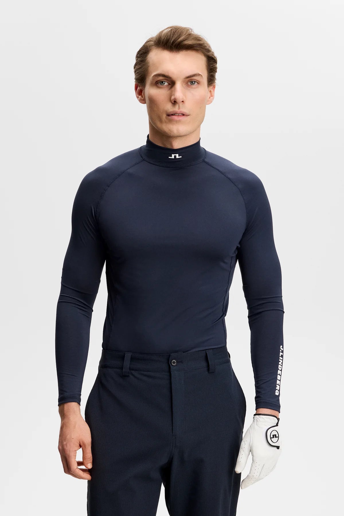 Navy mock-neck compression top with fitted long sleeves and sleeve logo
