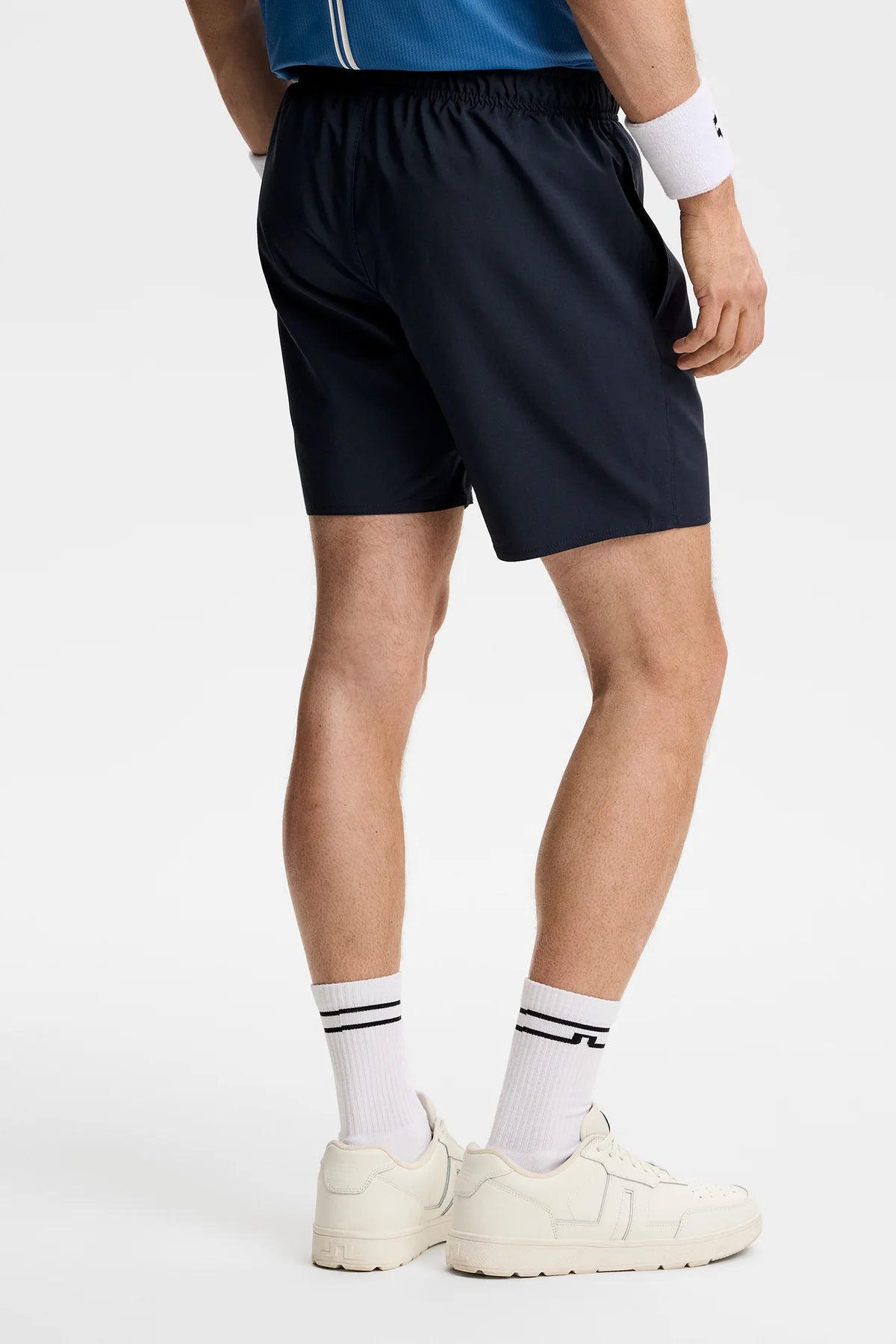 Navy athletic shorts with elastic waistband and side pockets
