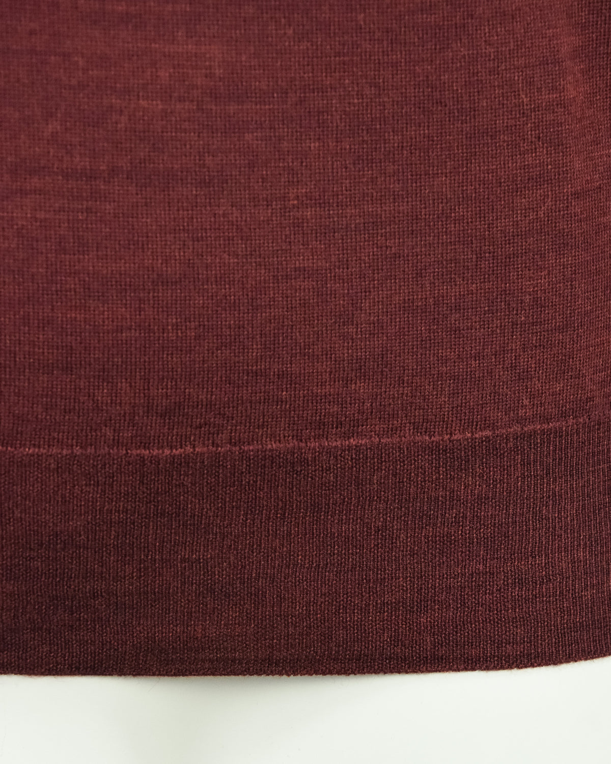 Burgundy knit jumper hem with ribbed cuff detailing