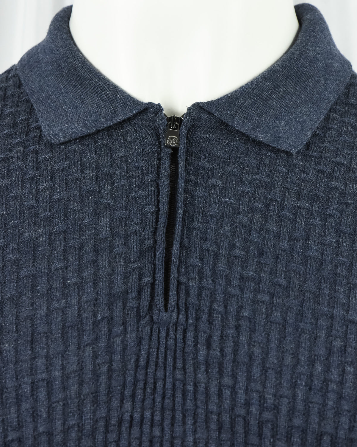 Blue textured knit polo with turn-down collar and front zip hardware