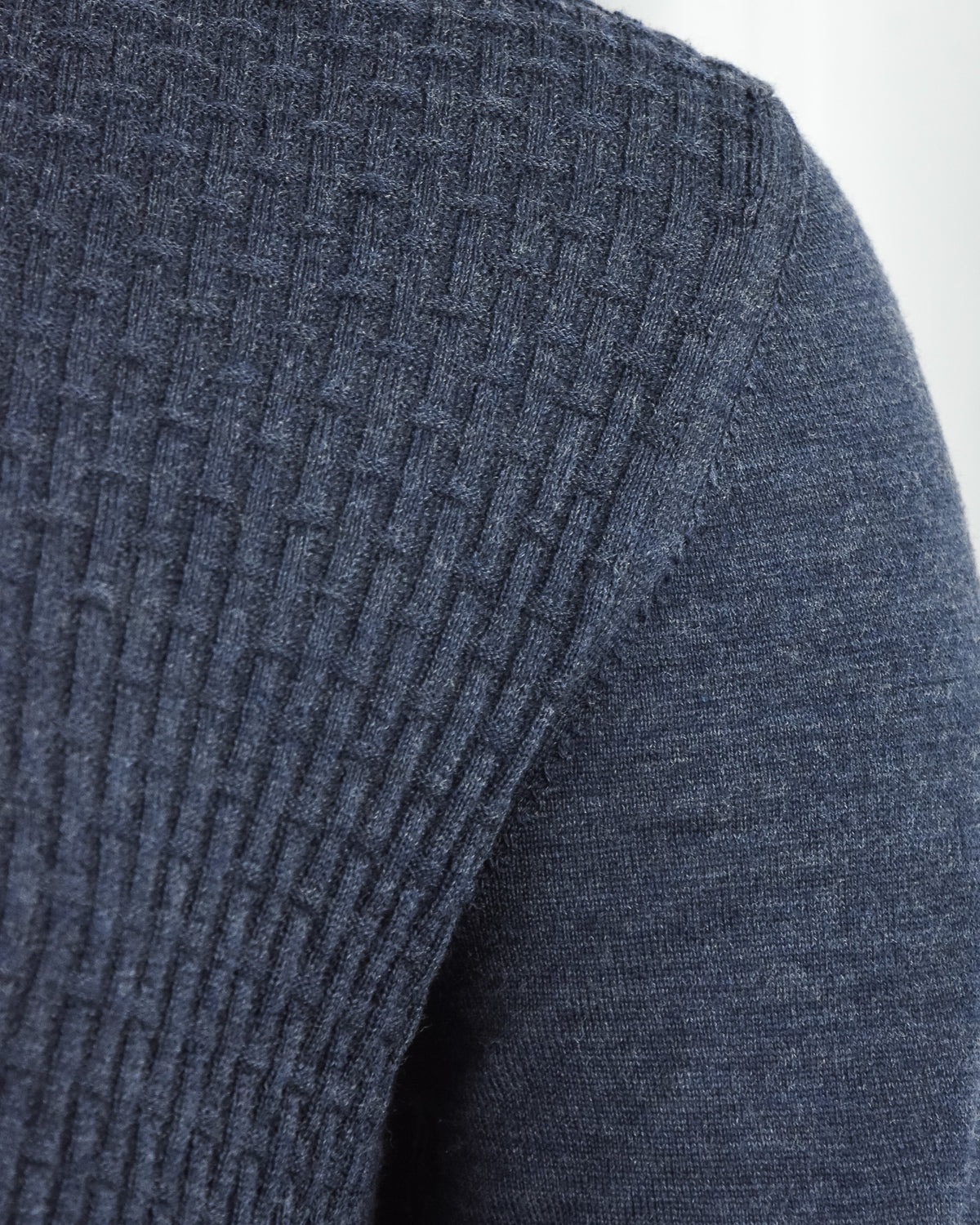 Blue long-sleeve textured zip polo sleeve with knit panel texture