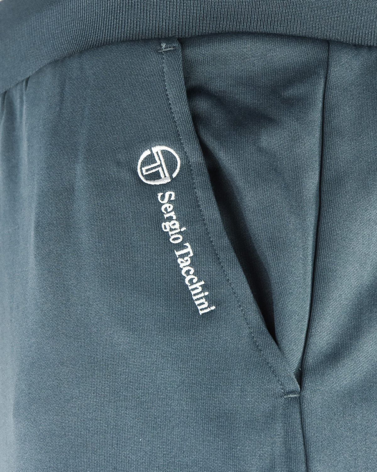 Track pants close-up: Sergio Tacchini logo on inner waistband