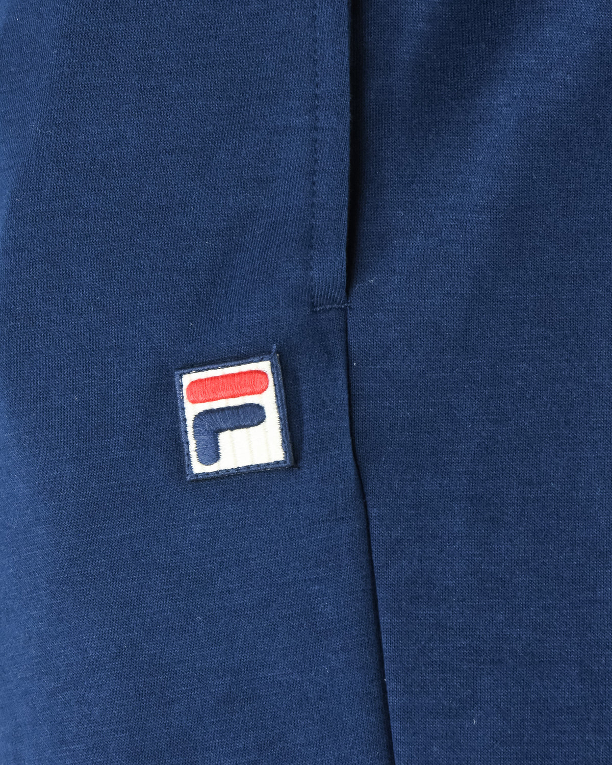 Navy jogger pants logo patch on front leg