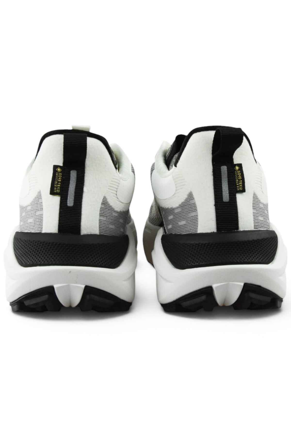 Back view of white and gray waterproof running shoes with black heel support