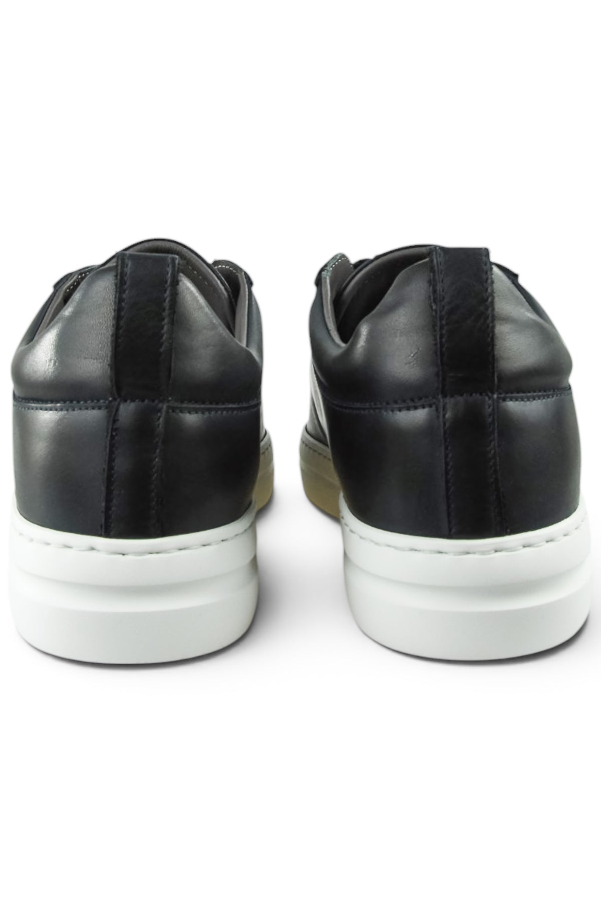 Back view of navy leather low-top sneakers with padded collar and white midsole.