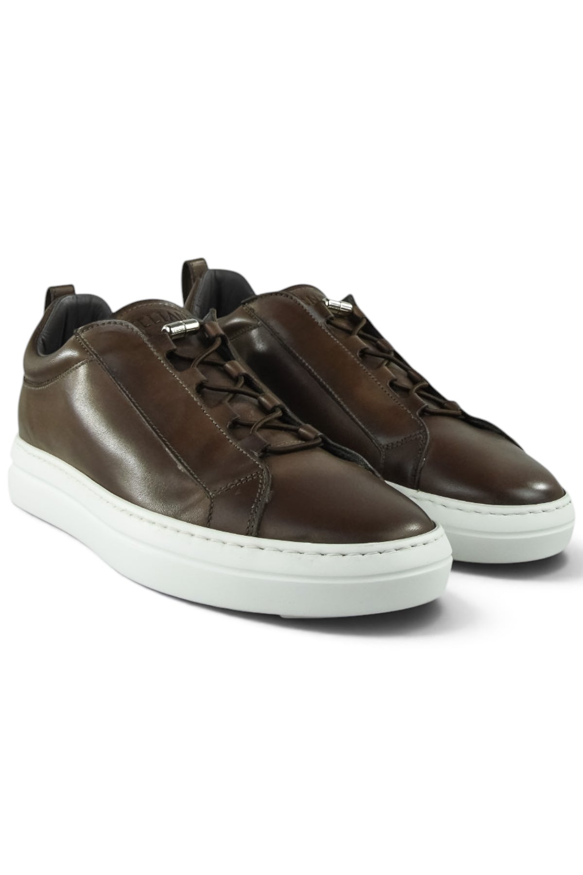 Pair of brown leather low-top trainers with lace-up and white rubber soles