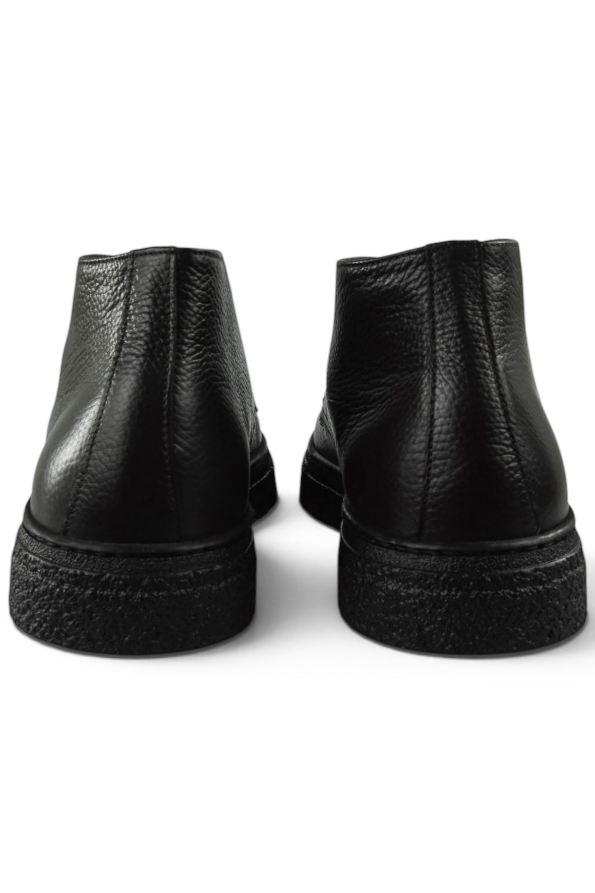 Back view of black leather lace-up ankle boots showing heel and textured sole edge.
