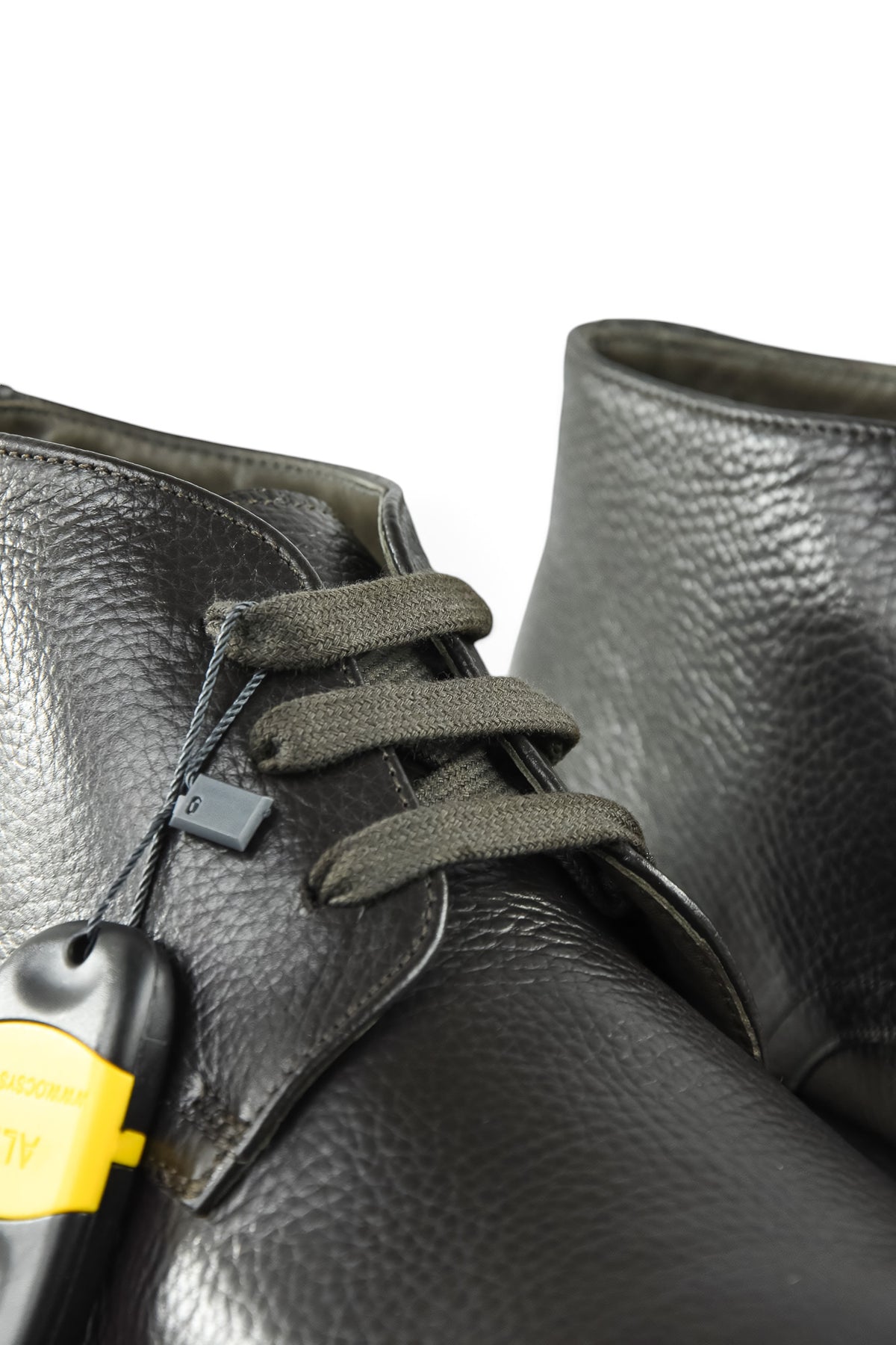 Dark leather ankle boot with lace-up front and metal eyelets