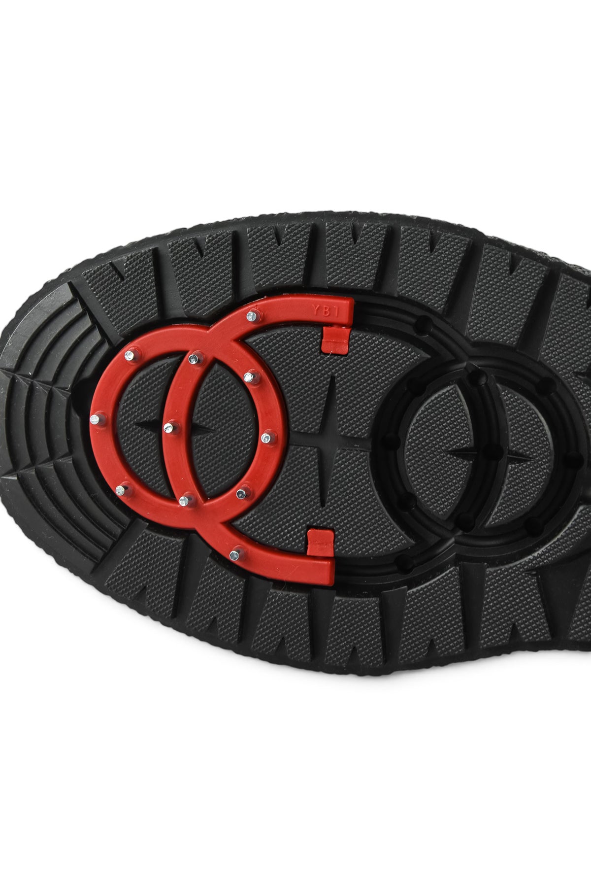 Boot outsole with deep lug tread and red O-ring style logo