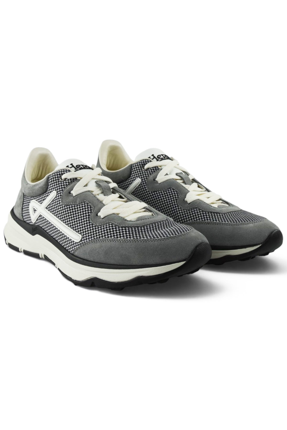 Grey knitted and suede trainers with white laces, side logo, and black rubber sole