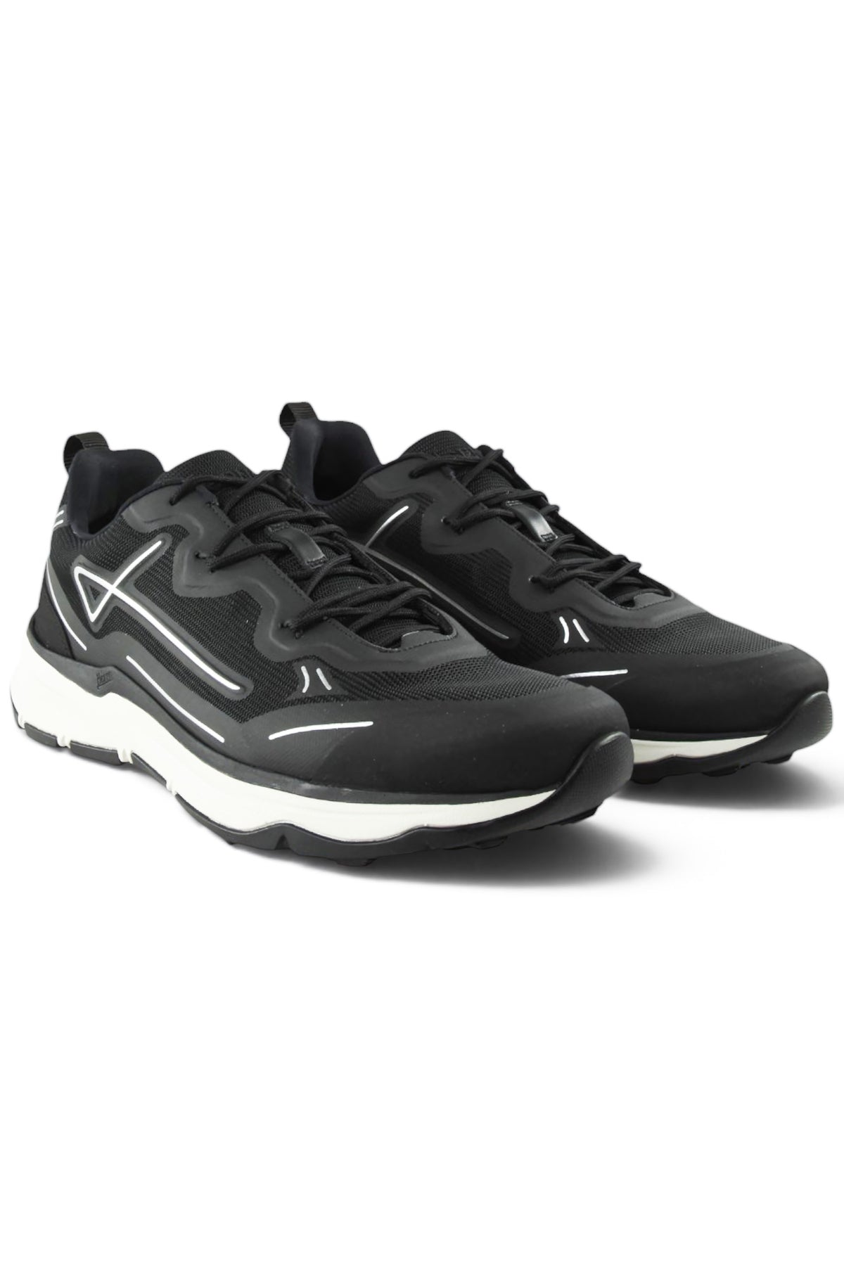 Pair of black lace-up tech trainers with mesh uppers, white midsole, and thick sole