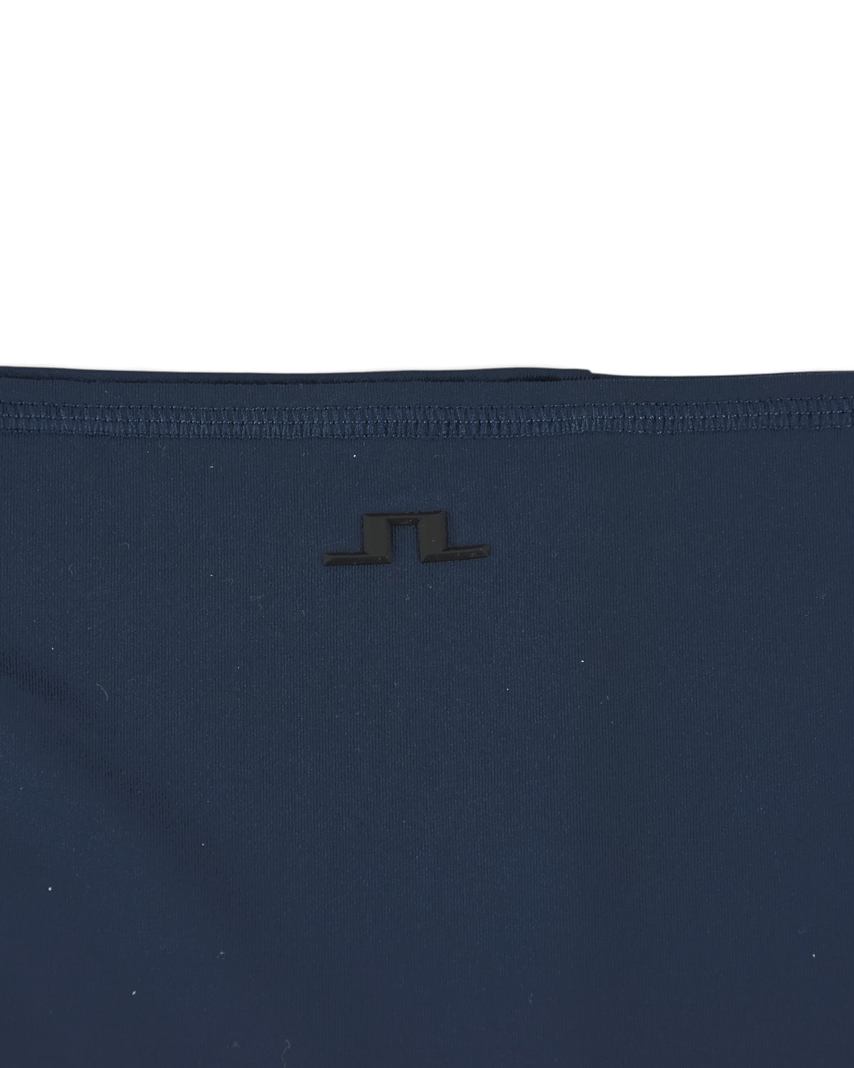 Navy neck gaiter close-up of center logo on fabric