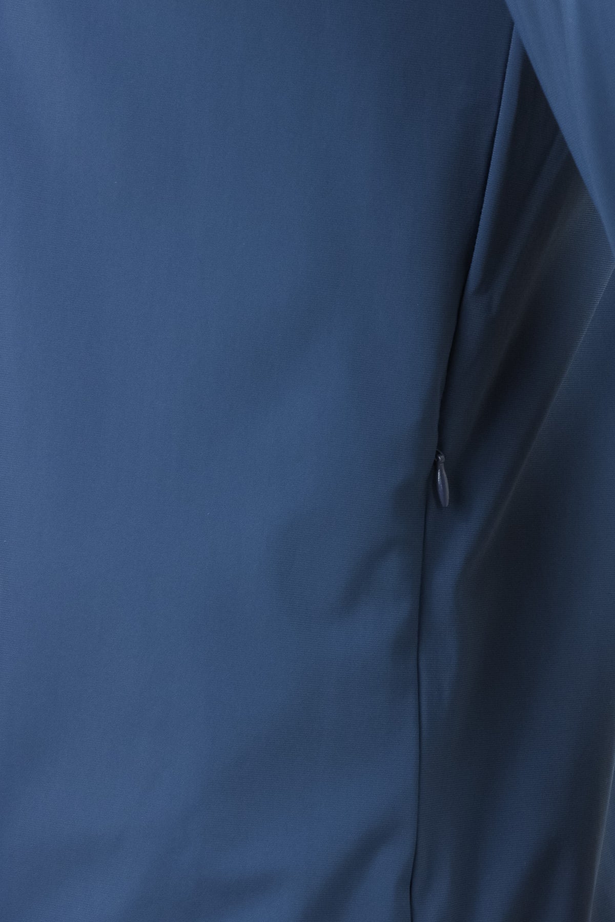 Blue tech stretch jacket side panel with full zipper seam detail