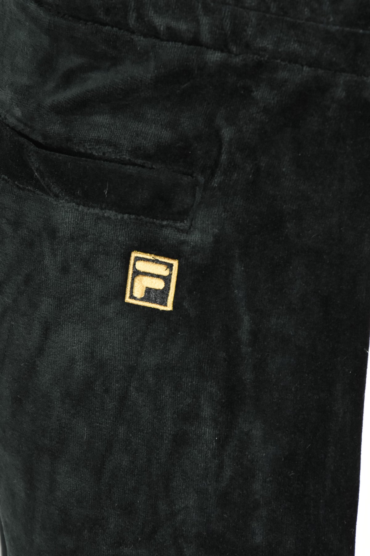 Velour track pants logo patch on front pocket