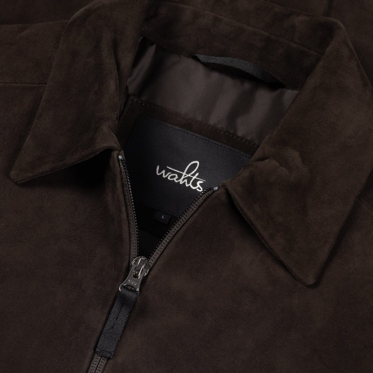 Soft suede city jacket detail: front zip, stand collar, WAHTS inner label