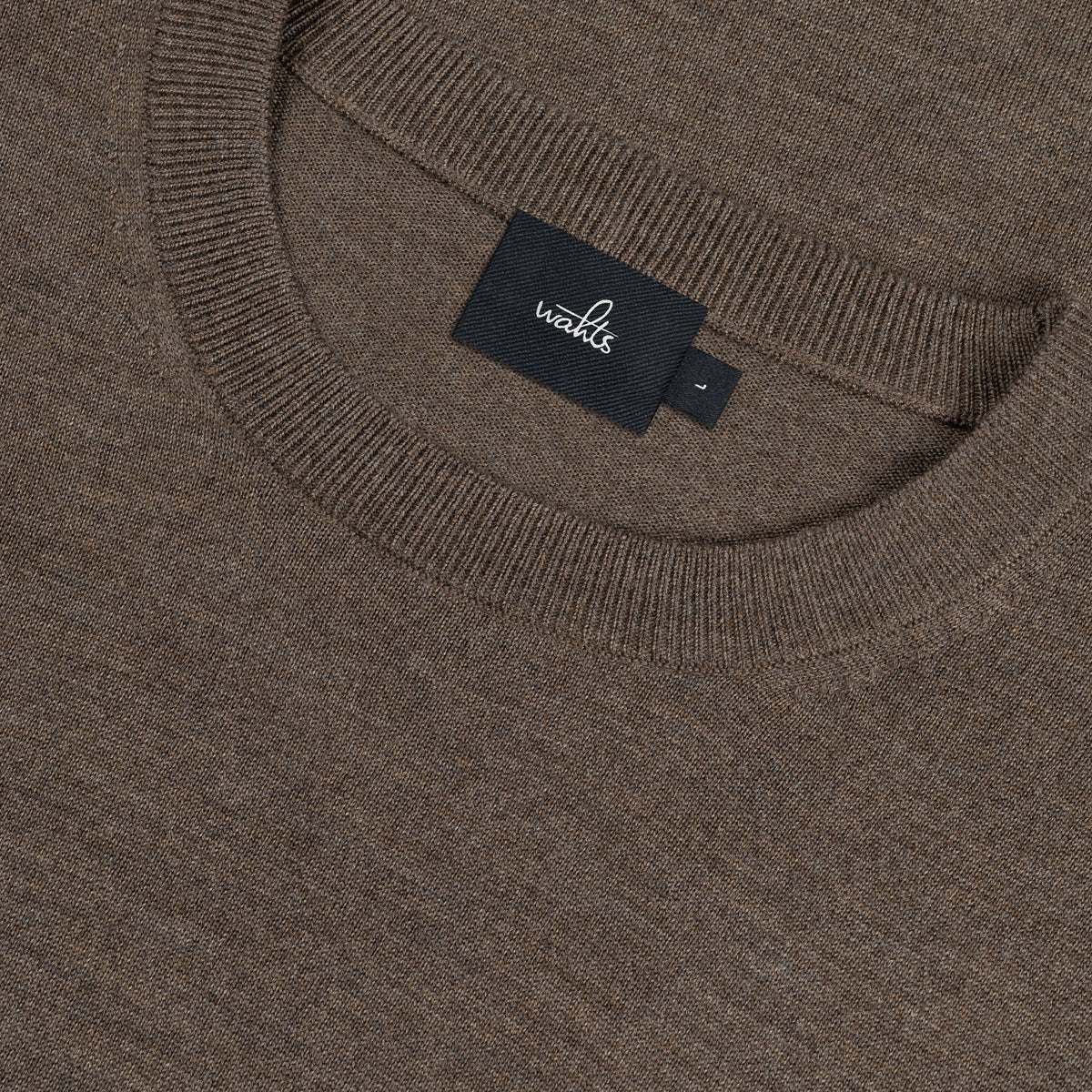 Taupe melange merino knit crewneck with brand tag inside collar