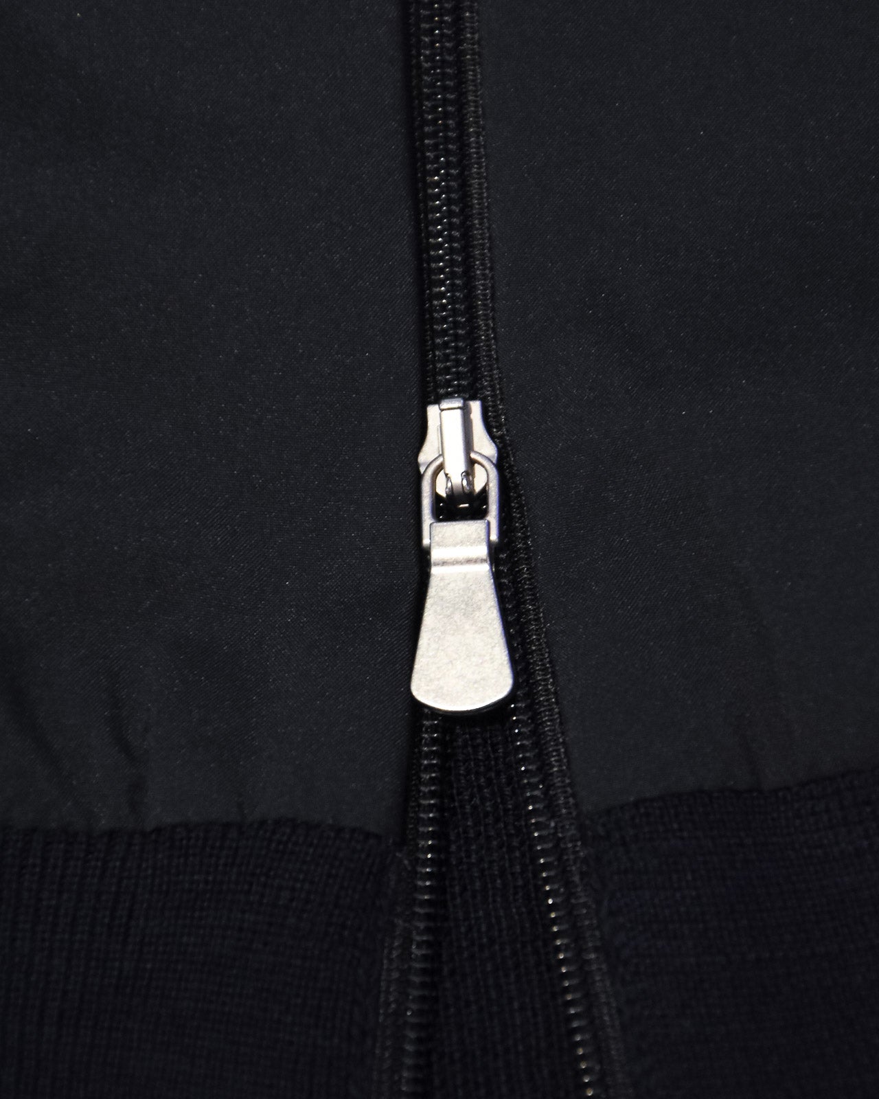 Navy jacket zipper with metal pull tab