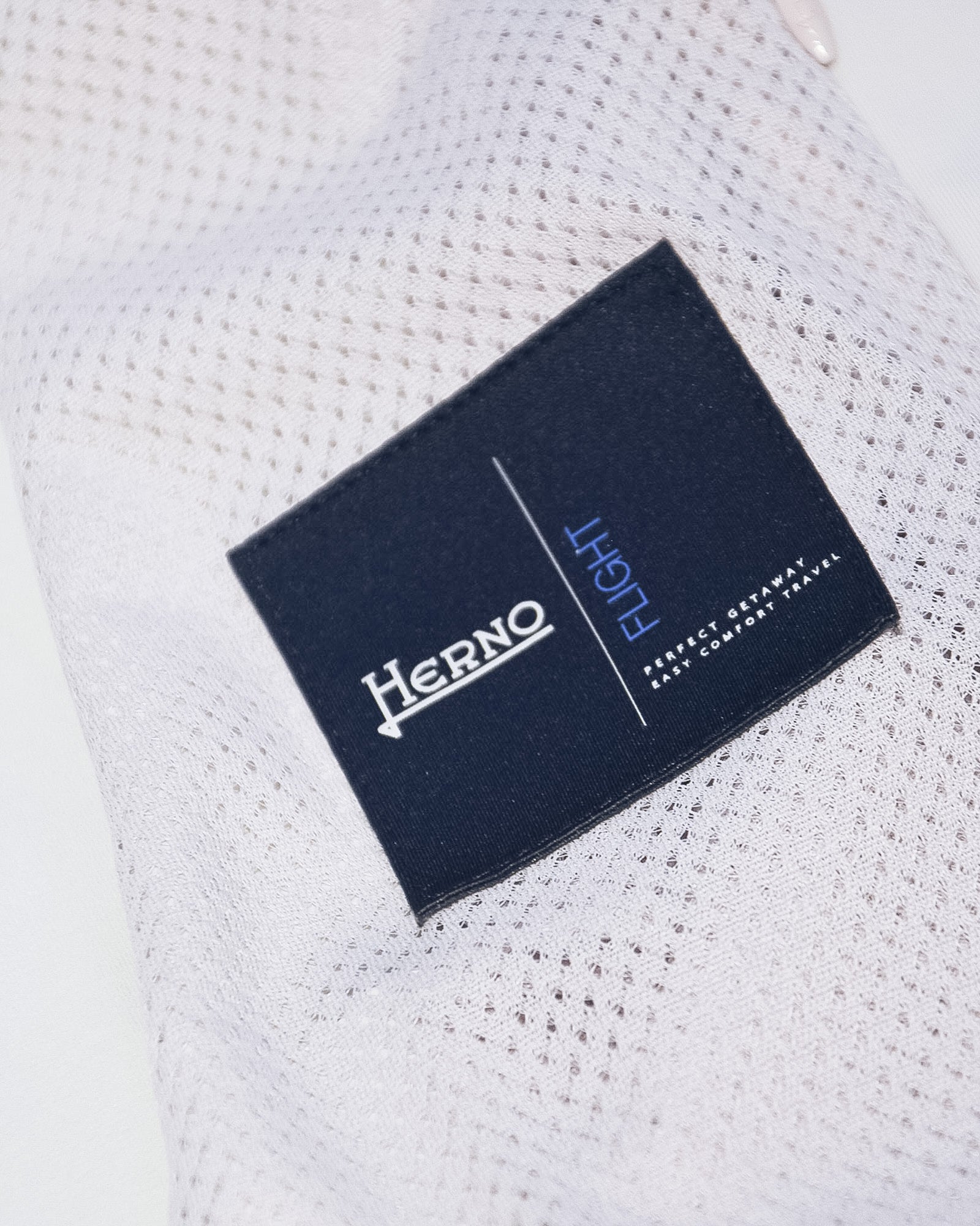 Herno logo fabric label on off-white nylon bomber jacket