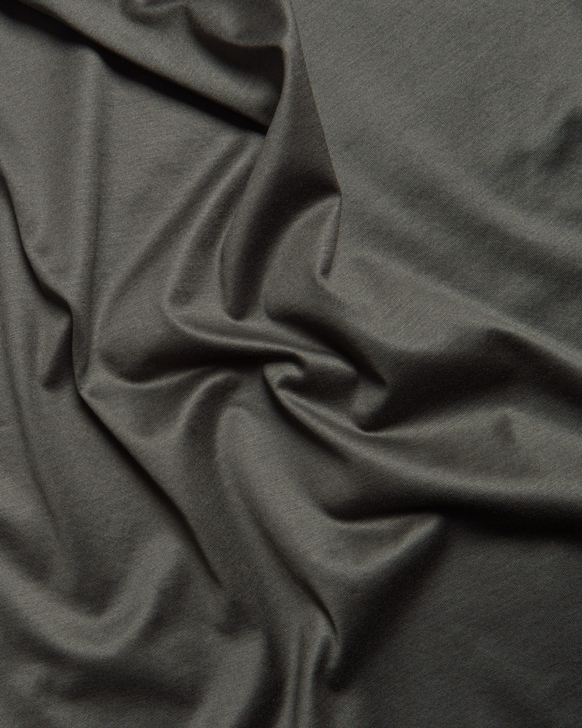 Dark green mercerised T-shirt fabric with smooth drape