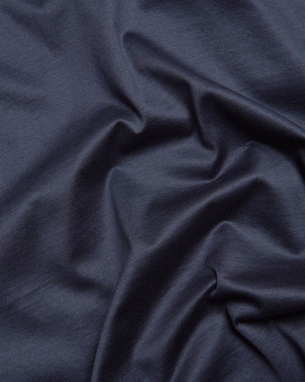 Navy mercerised short sleeve T-shirt fabric close-up