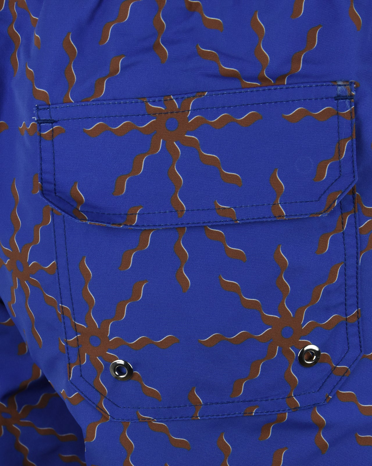 Cobalt blue swim shorts with terrazo floral print, front pocket and white drawcord