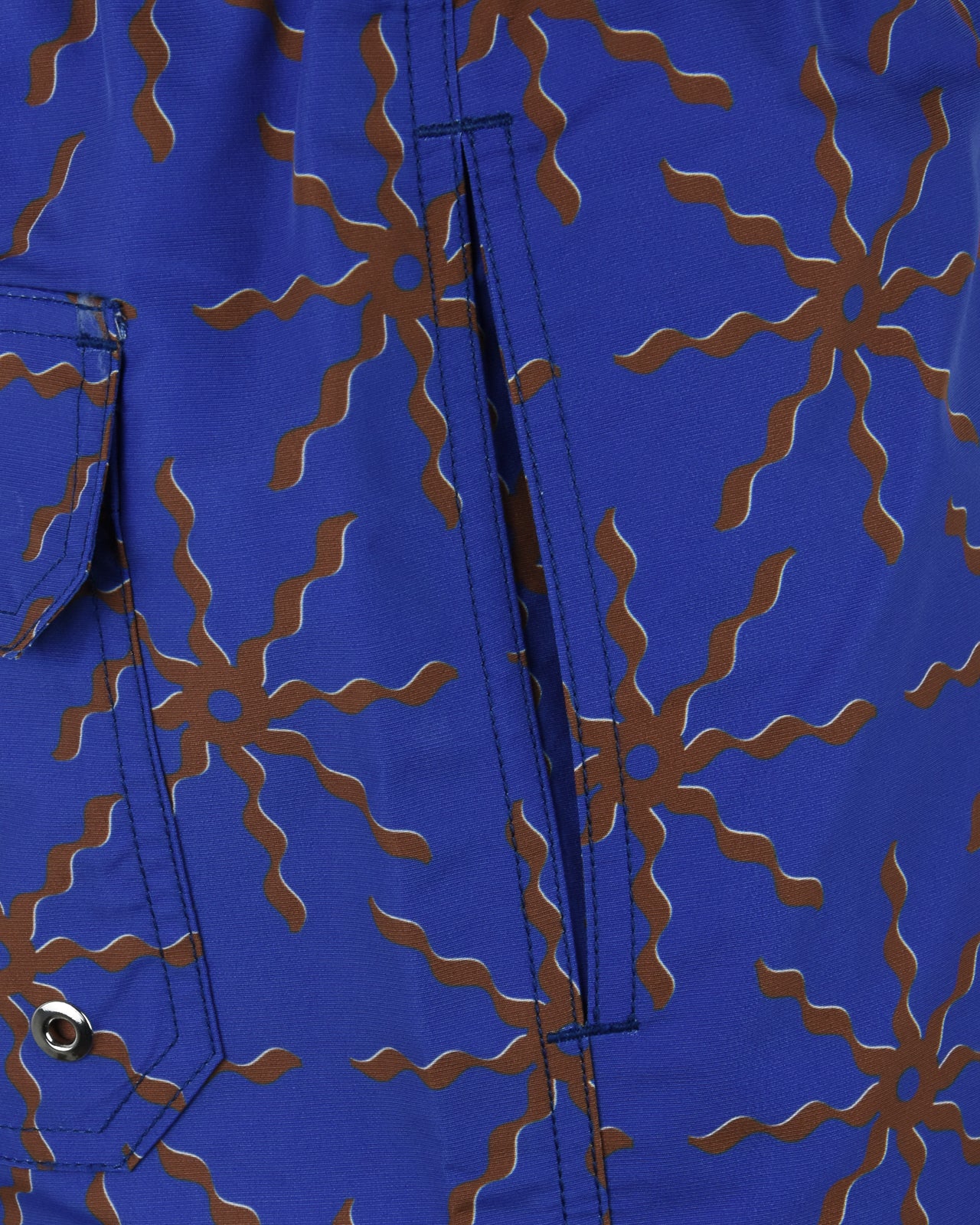 Cobalt blue swim shorts with terrazo floral print, side pocket flap and metal snap