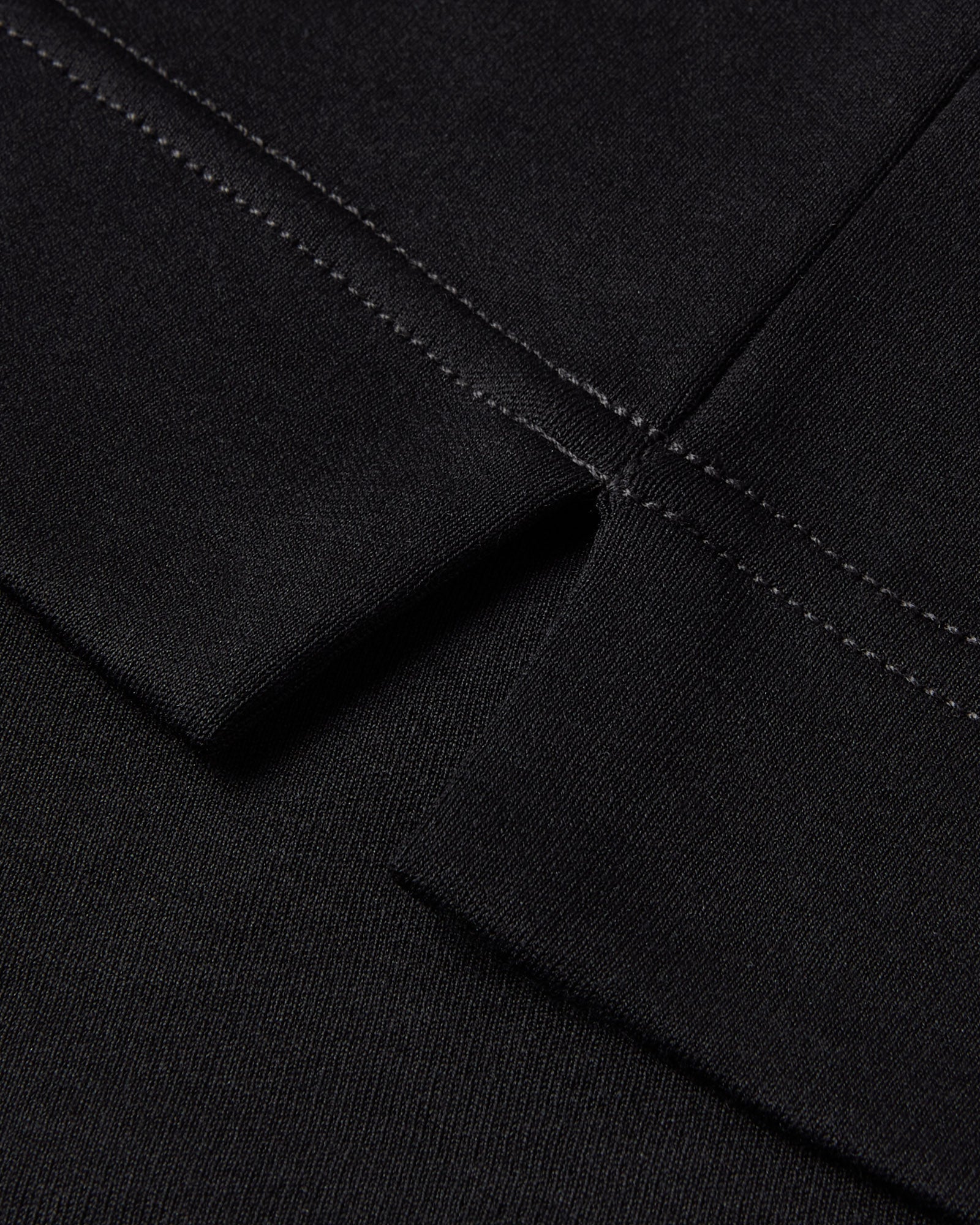 Black Supima cotton T-shirt sleeve hem with double-stitched seam
