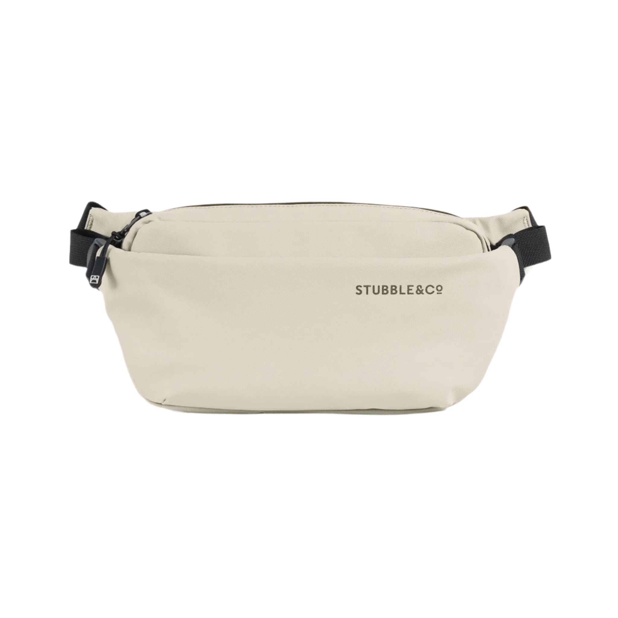 Stubble & Co waterproof crossbody bag in sand with front logo, zip closure, and strap