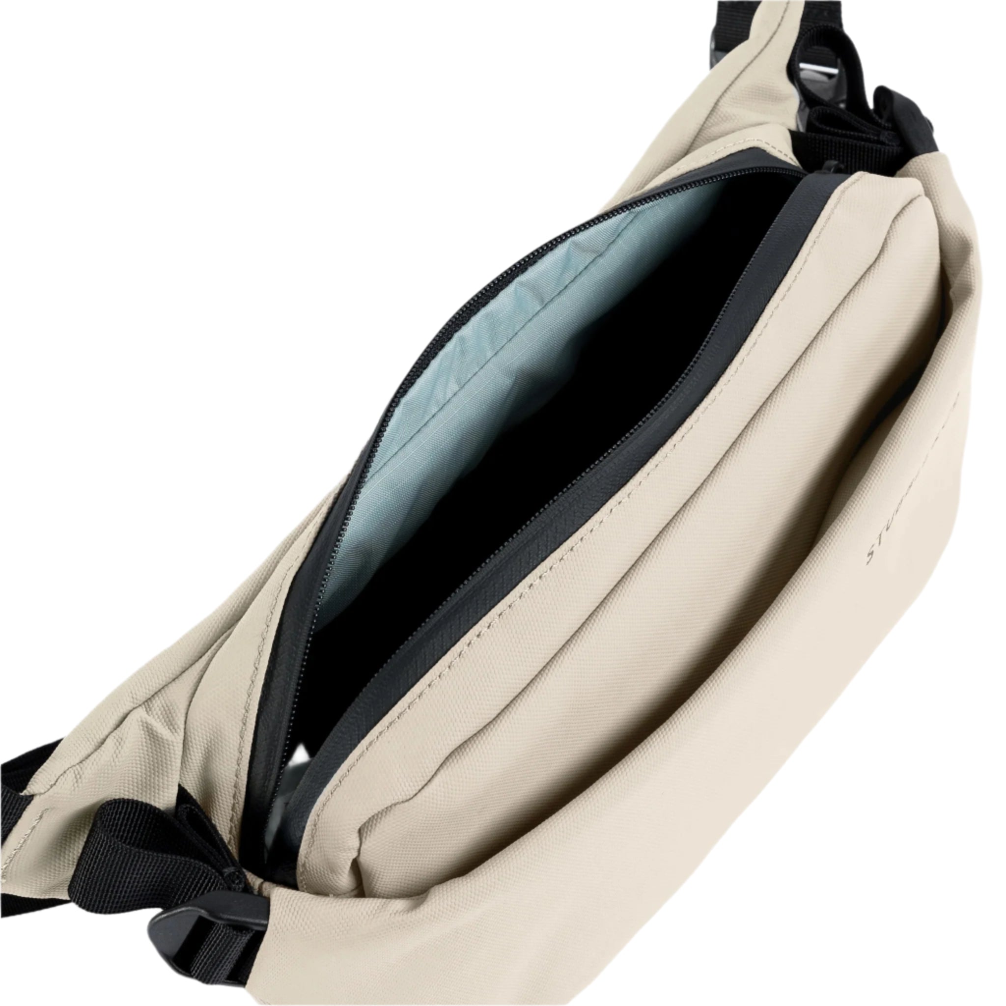 Stubble & Co crossbody bag interior view with zipped opening and blue-gray lining
