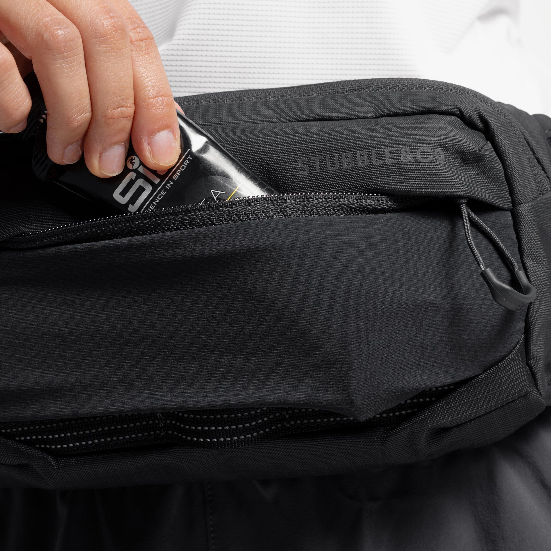 Charcoal waste pack open at top with zipper and interior lining