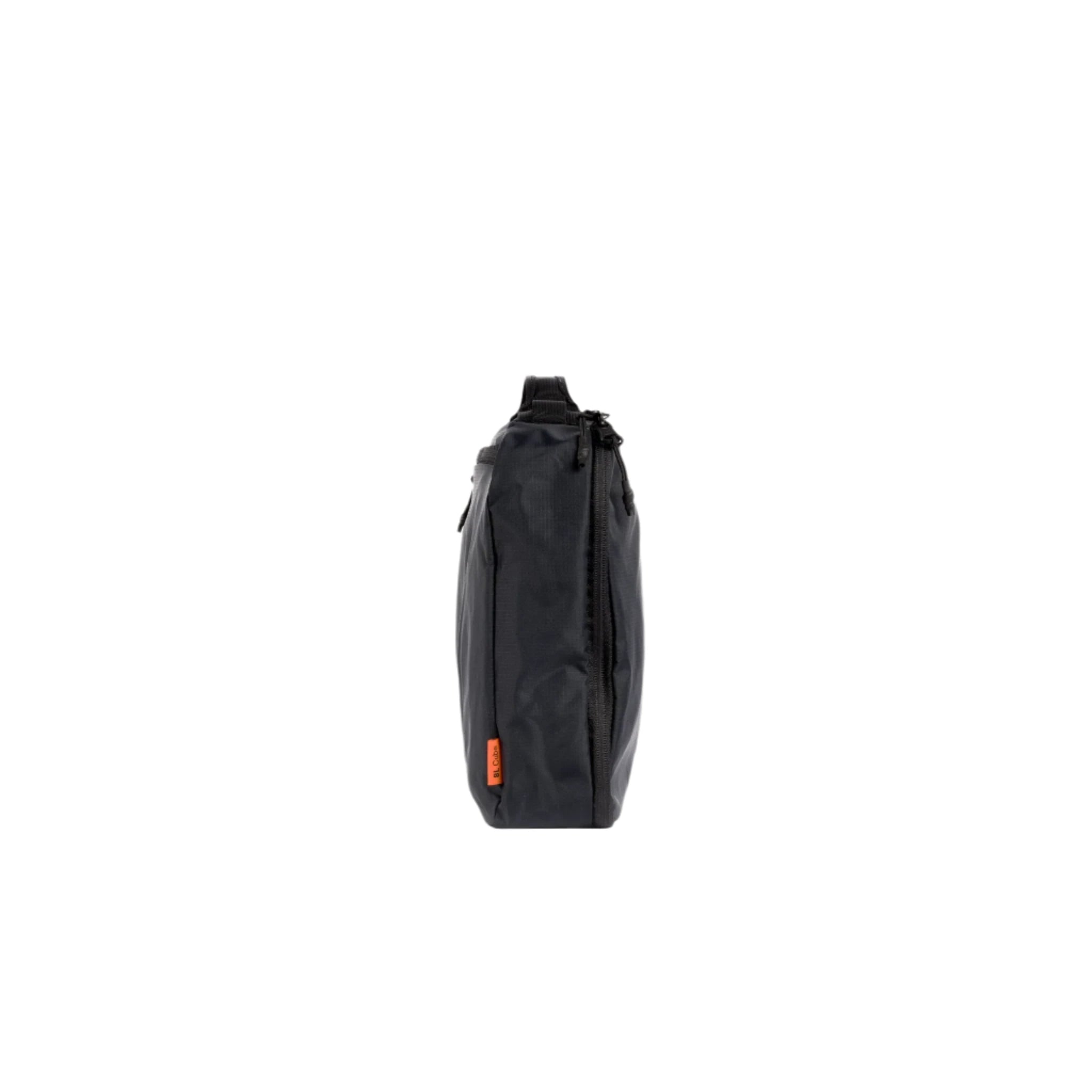Black packing cube side view with zipper pull and orange logo tag