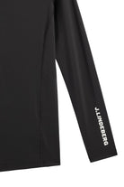 Black compression long-sleeve top with mock neck and sleeve logo text.