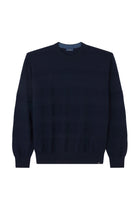 Navy blue sweater on a light gray background