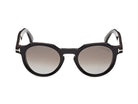 Shiny black round sunglasses front view, tinted lenses, glossy acetate frame