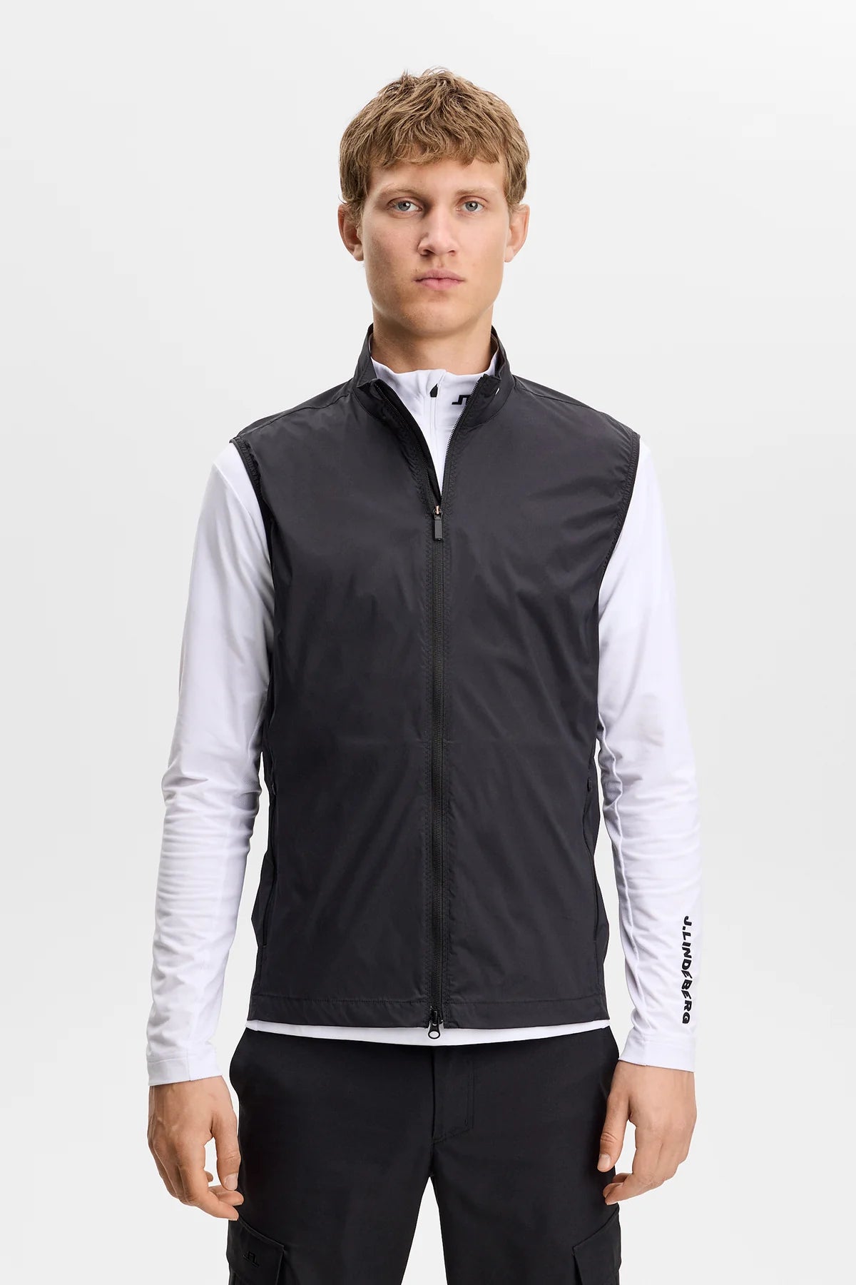 Black packable zip-up vest with stand collar and sleeveless front zipper.