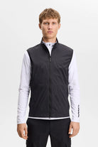 Black packable zip-up vest with stand collar and sleeveless front zipper.