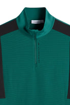 Teal quarter-zip mid layer with half zipper and black shoulder panels