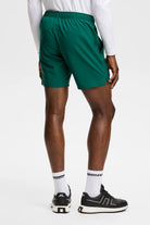 Dark green Preston shorts on model, back view with elastic waistband