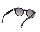 Shiny black round sunglasses three-quarter view, tinted lenses, angled temple
