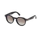 Shiny black round acetate sunglasses with tinted lenses and dark arms