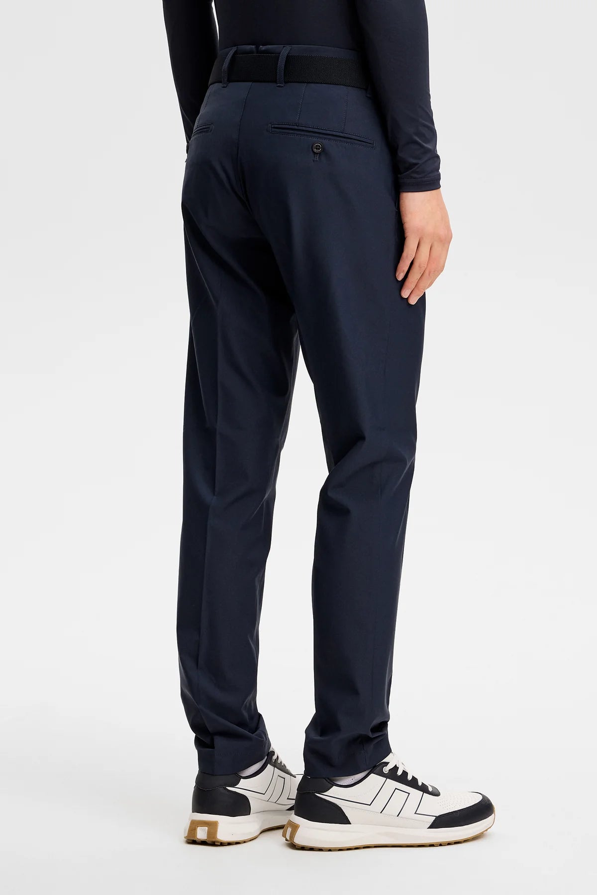 Navy pleated-front pants with belt loops and zip fly; straight tapered fit