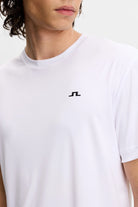 White crew-neck T-shirt close-up with small J.Lindeberg chest logo