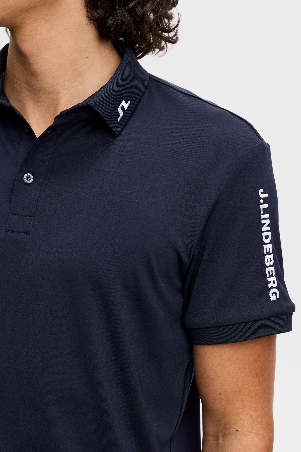 Men's navy polo shirt with collar and J.Lindeberg sleeve lettering