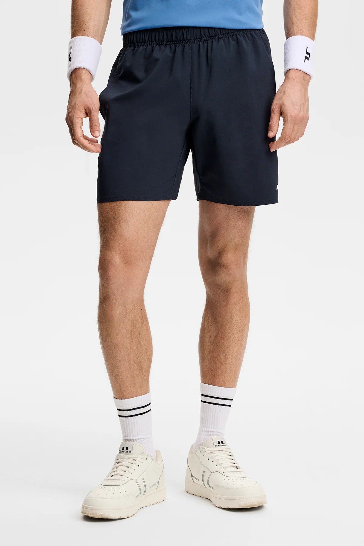 Navy athletic shorts with elastic waistband and straight hem
