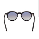 Shiny black round sunglasses front view with tinted lenses and slim bridge