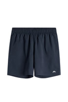 Navy athletic shorts with elastic waistband and small logo at right hem