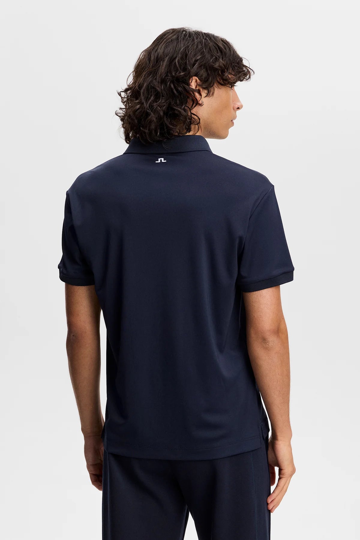 Men's navy J.Lindeberg tour tech polo, back view with logo