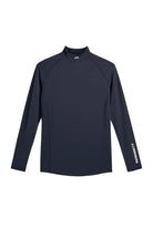 Navy long-sleeve mock-neck compression top, flatlock seams and small chest logo